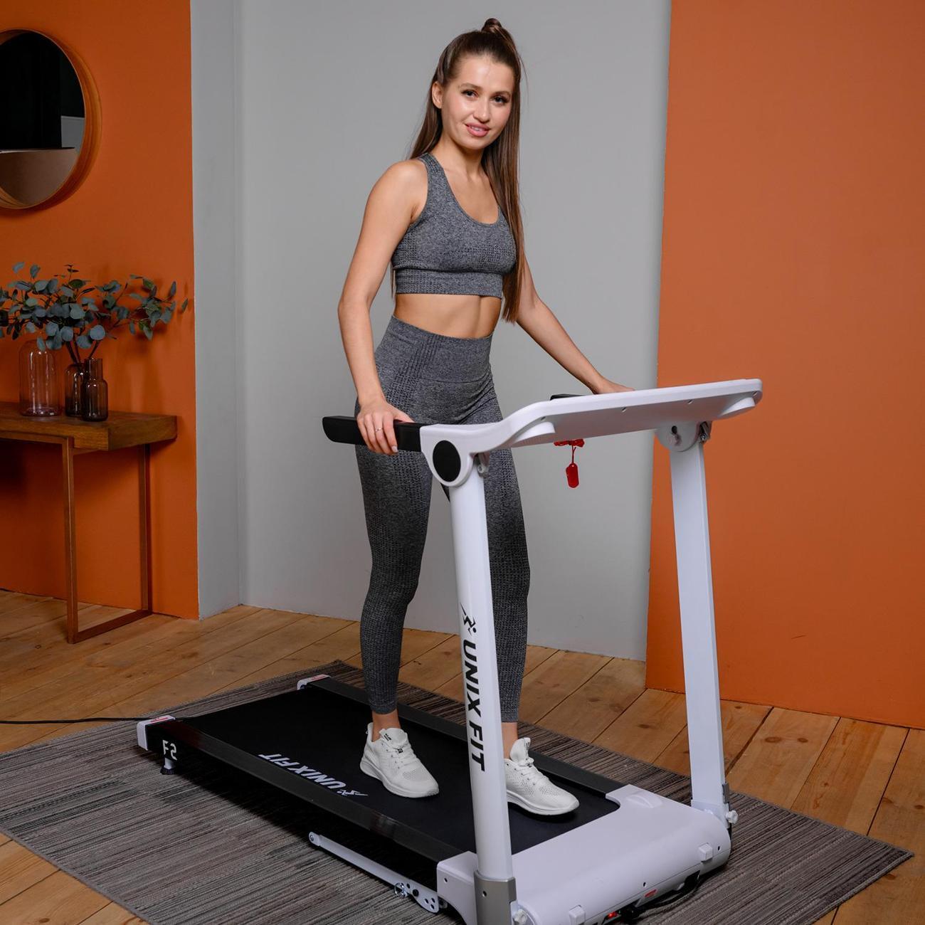 Беговая дорожка для дома UnixFit высокотехнологичная / Hi-tech F2 холодный белый складная, бесконтактное управление, пиковая мощность 3 л.с. до 120 кг, скорость 0.8-16 км/ч, угол наклона 0-15%
